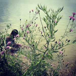 My little sister collecting rocks. 