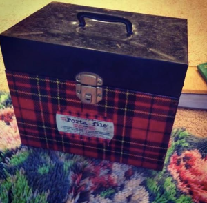 Reading a tin of old family letters. 