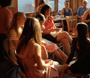 Talking to the audience before taking to the stage. 