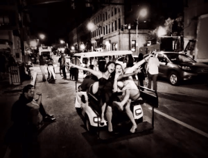 Sneaking a ride on the cart before getting getting kicked off. Looks like a scene on a hollywood set.