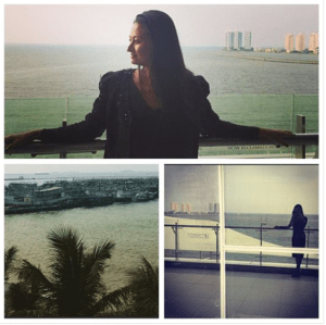 Lunch on the Bay in Jakarta with Fishermen boats and high-rises in the water. 