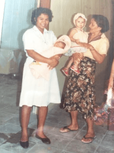 Me held by the nurse and Grace by my great grandmother. 